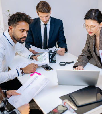 Virtual Consultants engineering team reviewing work at a table